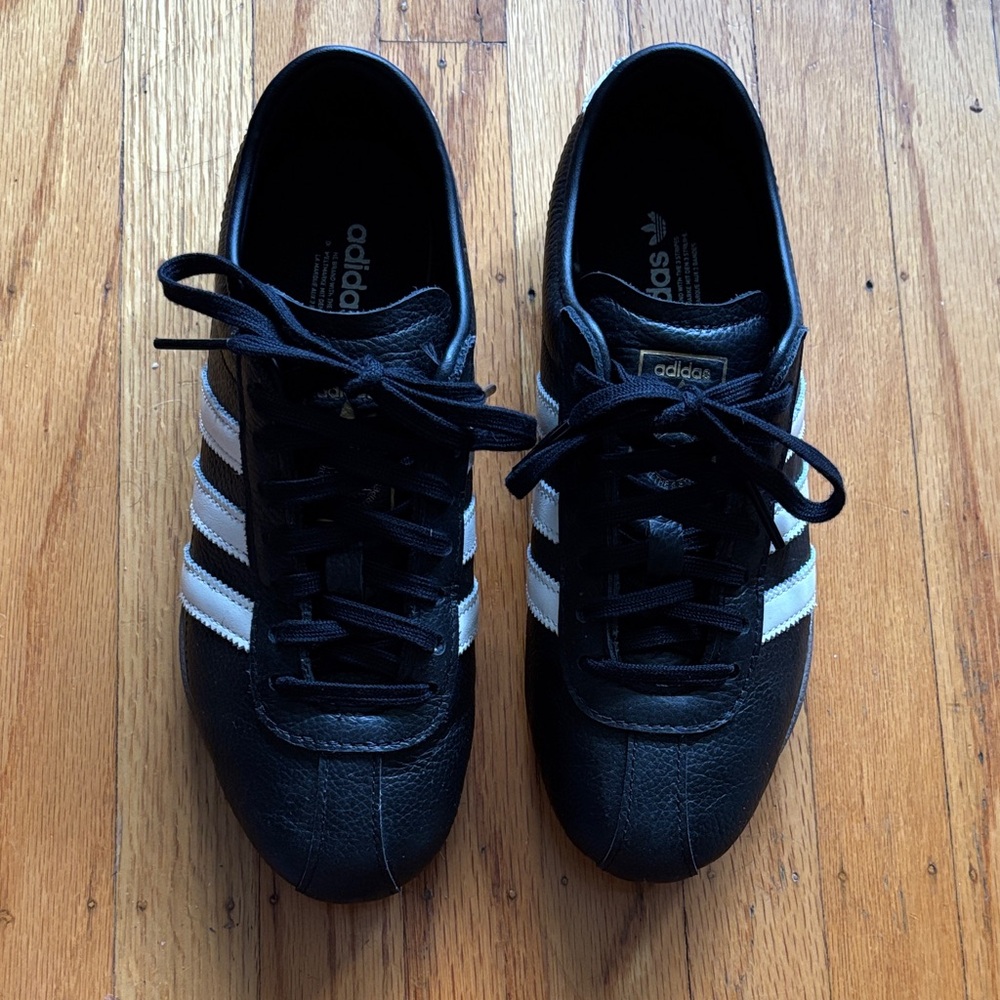 Adidas Women’s Black Sneakers with White Stripes